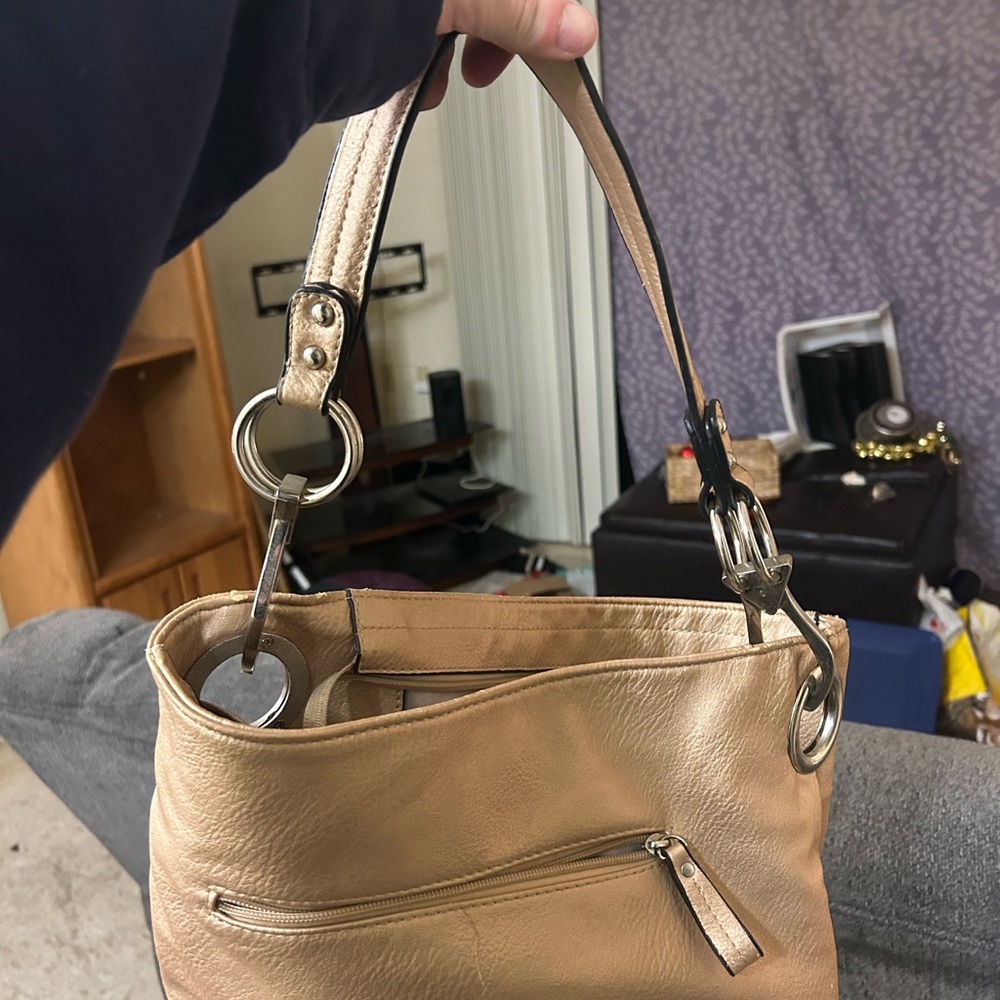 Gold Shoulder Bag with Slouchy Shape and Metal Hardware